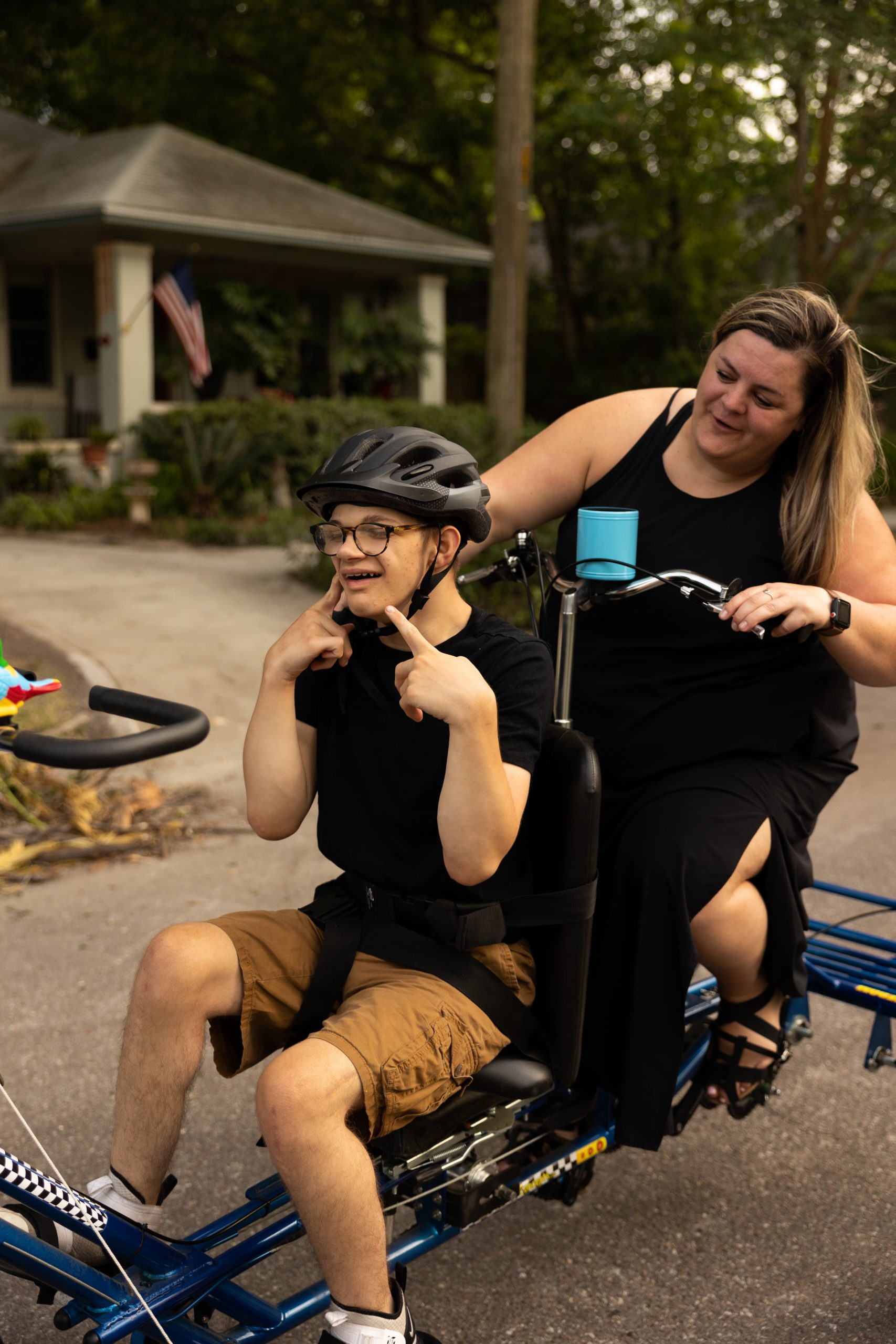 Tyler and Caitlin riding an adaptive tandem bike