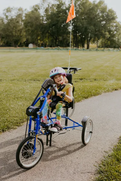 Amy with Spinal Bifida, riding her bike