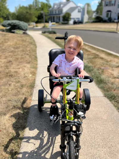 Everett with cerebral palsy riding a bike