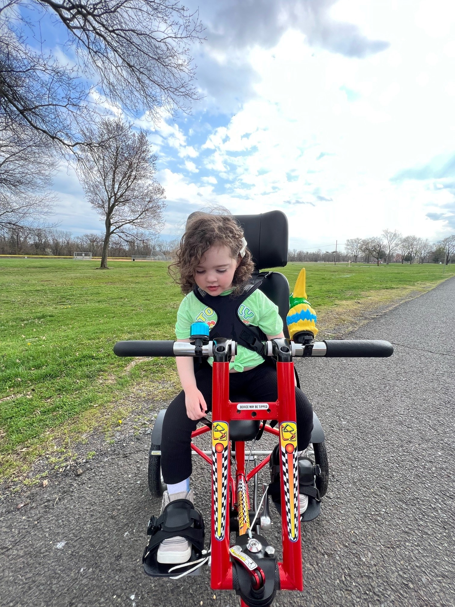 Ava on her mobility bike